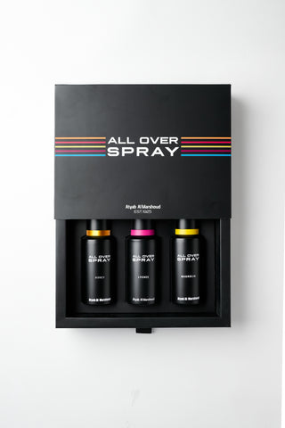 A black rectangular spray kit box with the words 'ALL OVER SPRAY' and thin multicolor stripes, shown open to reveal three black bottles inside on a white background.